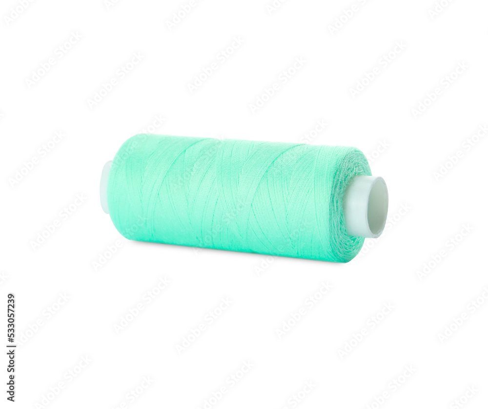 Spool of turquoise sewing thread isolated on white Spool of turquoise sewing thread isolated on white