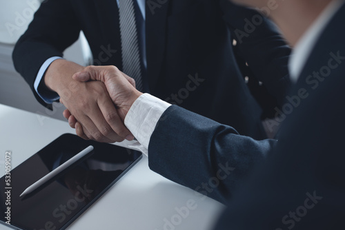 Business handshake. Two businessmen shaking hand after signing business contract at office, congratulation, investor, success, business interview, partnership, teamwork concept