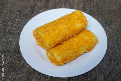 Risoles bihun or rissole with vermicelli noodle filling served on white plate. snacks that are cooked by frying, have a savory taste
