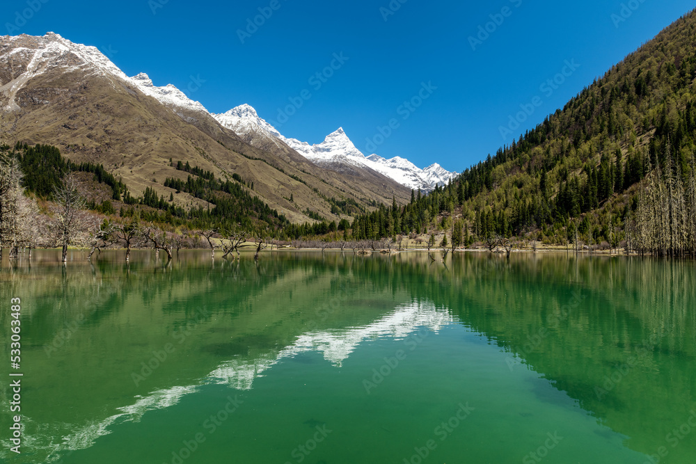 The lake and snow mountains in Four Girls Mountain scenic spot Chengdu city Sichuan province, China.