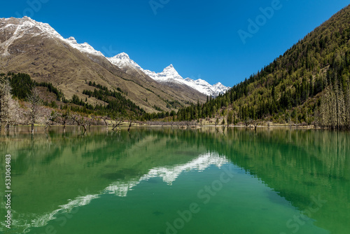 The lake and snow mountains in Four Girls Mountain scenic spot Chengdu city Sichuan province, China.