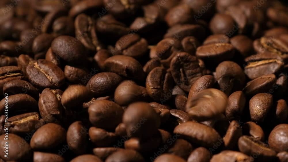 Slow motion of roasted coffee beans falling. Organic coffee seeds. Slow motion of roasted coffee beans falling. Organic coffee seeds.