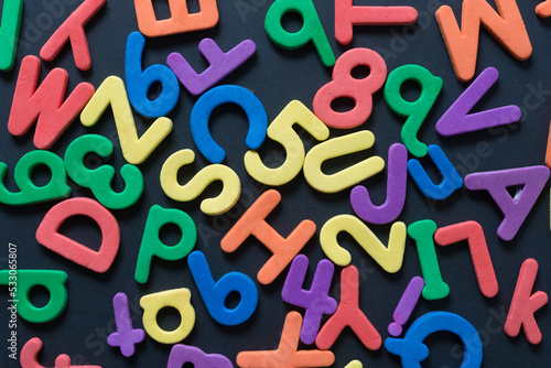 letters and numbers background (old foam letters on black paper)