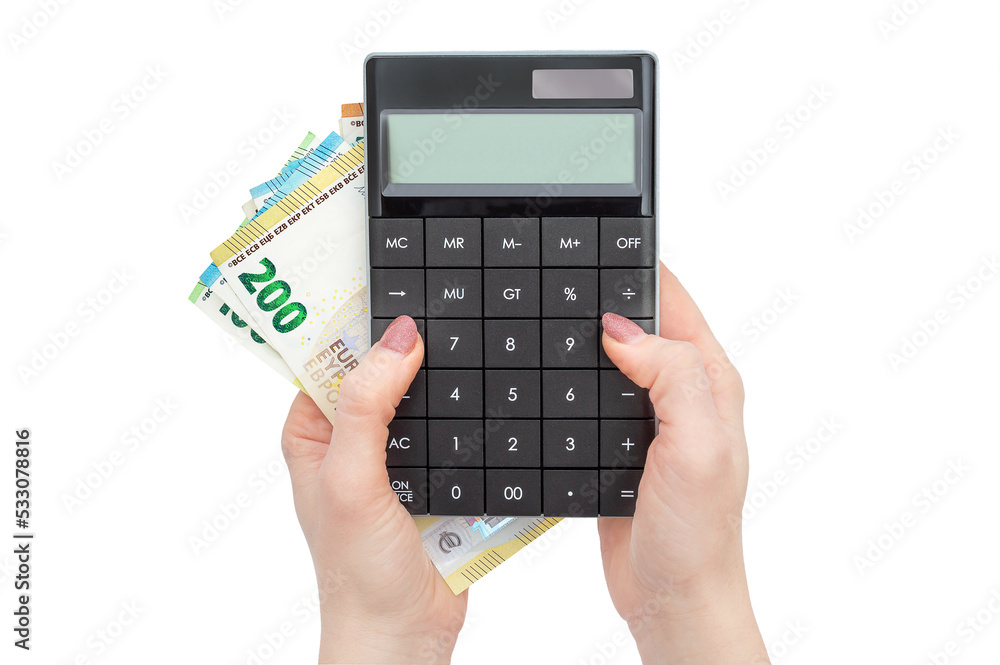 Woman's hand holding calculator with money. Isolated on white. Woman's hand holding calculator with money. Isolated on white.