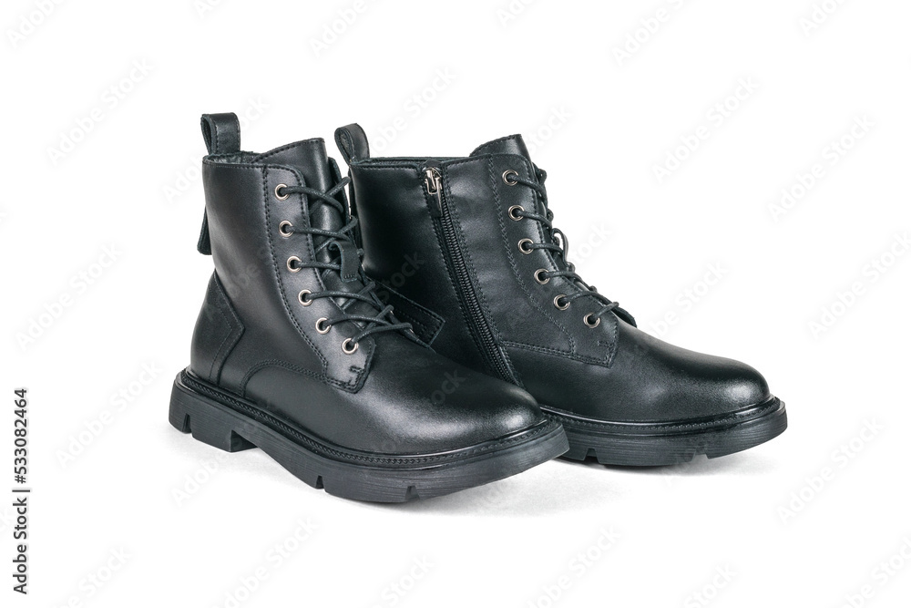 A pair of high leather demi-season boots isolated on a white background.
