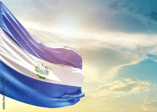  El Salvador national flag cloth fabric waving on the sky - Image photo