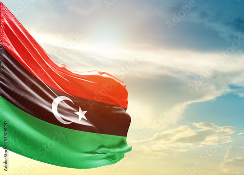 Libya national flag cloth fabric waving on the sky - Image