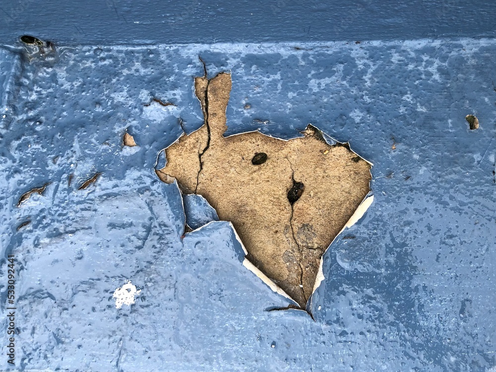 weathered facade outdoor wall. The layers of paint peeling off and