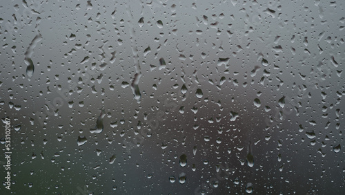 Tableau sur toile Real background of rain hitting glass window
