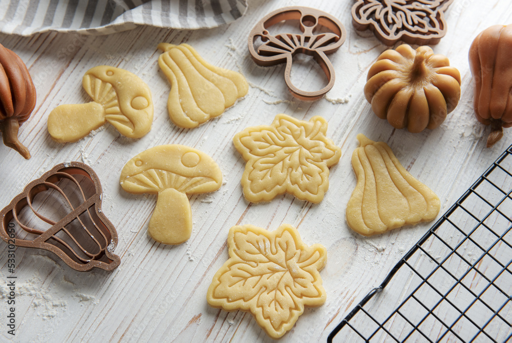 Baking cookies in the form of pumpkin and leaves Baking cookies in the form of pumpkin and leaves