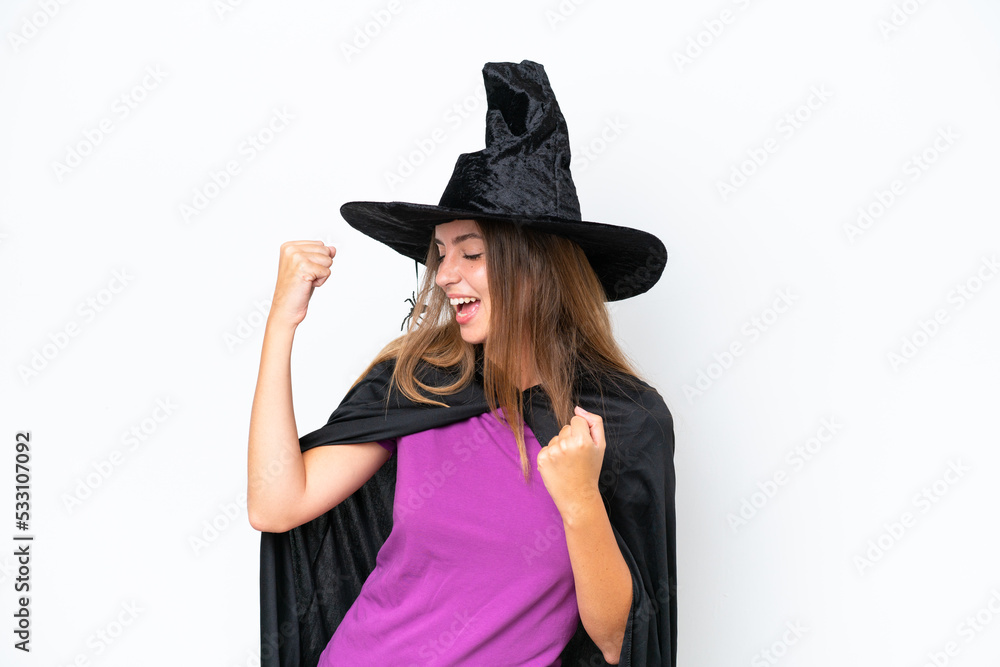 Young caucasian woman costume as witch isolated on white background celebrating a victory Young caucasian woman costume as witch isolated on white background celebrating a victory