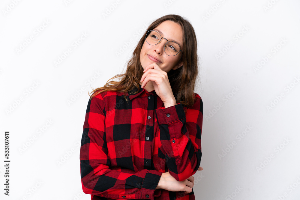 Young caucasian woman isolated on white background and looking up Young caucasian woman isolated on white background and looking up