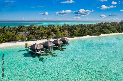 Maldives paradise island. Tropical aerial landscape, seascape turquoise water bungalows villas with amazing sea lagoon beach. Exotic tourism destination, summer vacation background. Aerial travel
