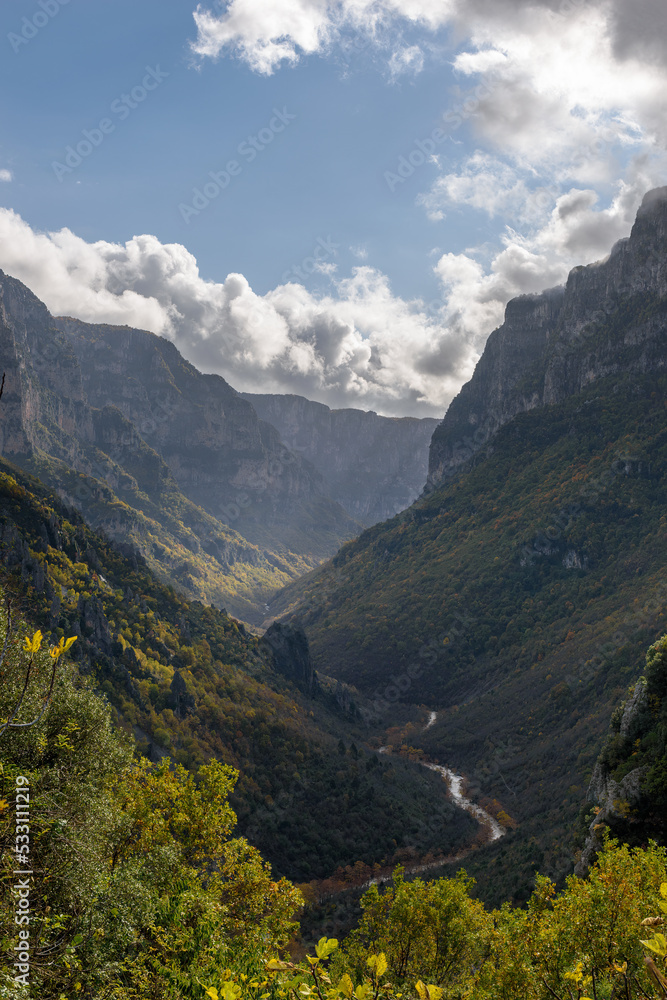 view of  Vikos Gorge, the deepest gorge in Europe, with fall colors near vikos village in Zagori Epirus, Greece.