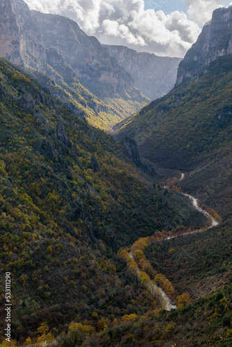 view of Vikos Gorge, the deepest gorge in Europe, with fall colors near vikos village in Zagori Epirus, Greece.