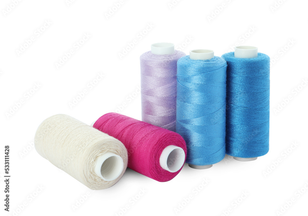 Many different colorful sewing threads on white background Many different colorful sewing threads on white background