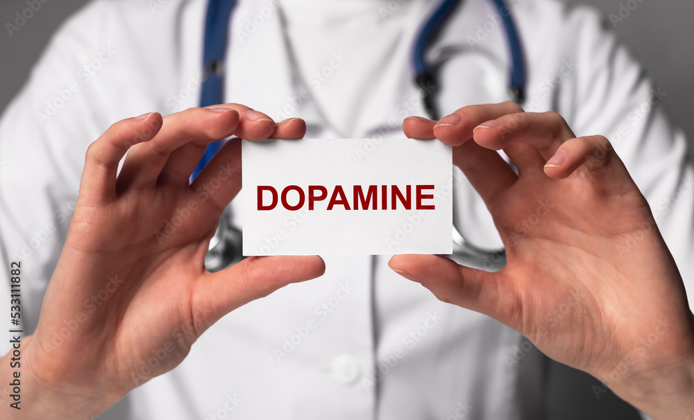 Doctor showing dopamine word. Chemical, hormone role in neurological and physiological functioning. Health care, medicine concept. High quality photo Doctor showing dopamine word. Chemical, hormone role in neurological and physiological functioning. Health care, medicine concept. High quality photo