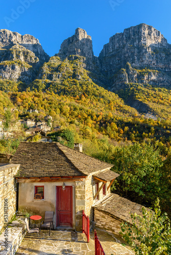 View of the traditional village Mikro Papigo with with the famous stone buildings during fall season in zagori Greece