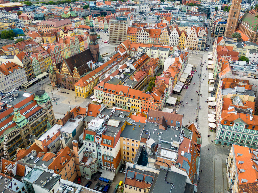 WROCLAW, POLAND - 06 SEPTEMBER, 2022: Wroclaw. Aerial View of Old Town of Wroclaw. Colorful Roofs of Historic Market Squere. Wroclaw, Poland. Europe. WROCLAW, POLAND - 06 SEPTEMBER, 2022: Wroclaw. Aerial View of Old Town of Wroclaw. Colorful Roofs of Historic Market Squere. Wroclaw, Poland. Europe.