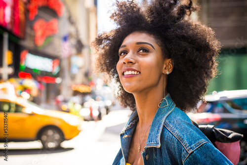 Beautiful afro-american woman walking in New York - Young black female adult tourist in Manhattan, USA © oneinchpunch