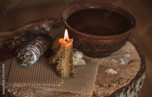 Candle burns on the altar, powerful magic among candles, energy cleaning and wicca concept 