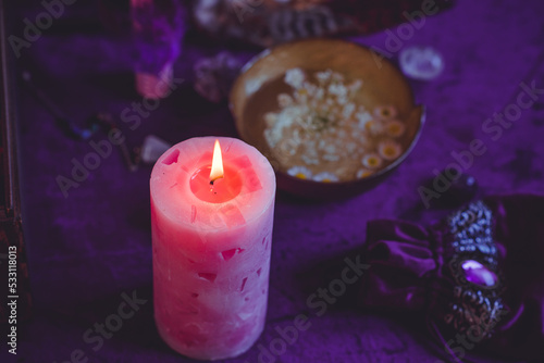 Candle burns on the altar, powerful magic among candles, energy cleaning and wicca concept 