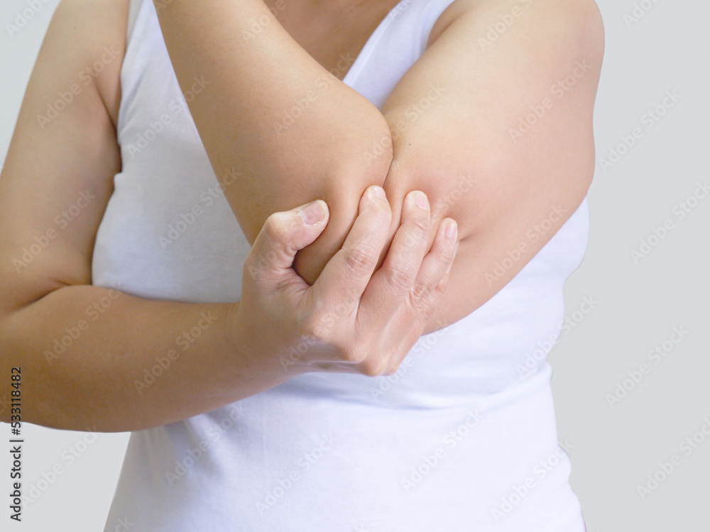 A woman elbow pain needs a massage to relax and health care A woman elbow pain needs a massage to relax and health care