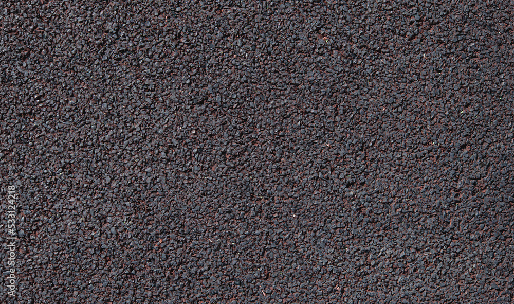 Obraz premium Soft rubber granular flooring surface close up dark red colored