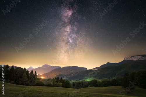 Milky way above the mountains and the trees. nightscape with the milky way photo