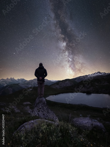 Milky way above a moutain lake. Mirror reflection of the milky way