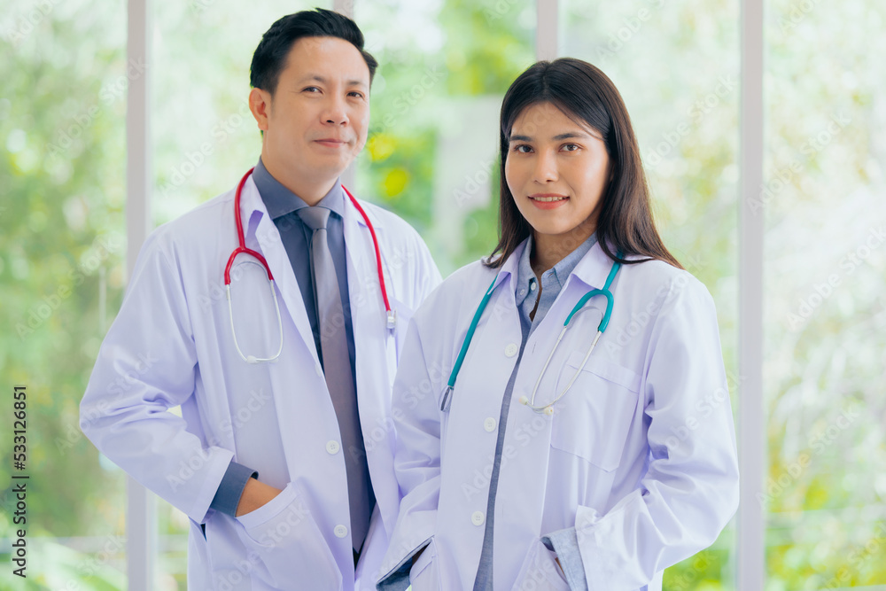 Portrait of young cheerful smiling nurse and doctor at hospital Portrait of young cheerful smiling nurse and doctor at hospital