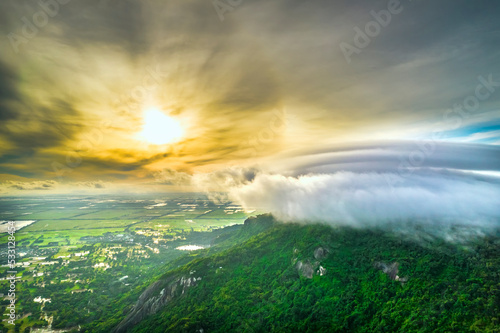 Morning on the top of Tri Ton mountain  An Giang  Vietnam when the clouds cover and the sun rises to welcome a peaceful new day in the border region of Vietnam