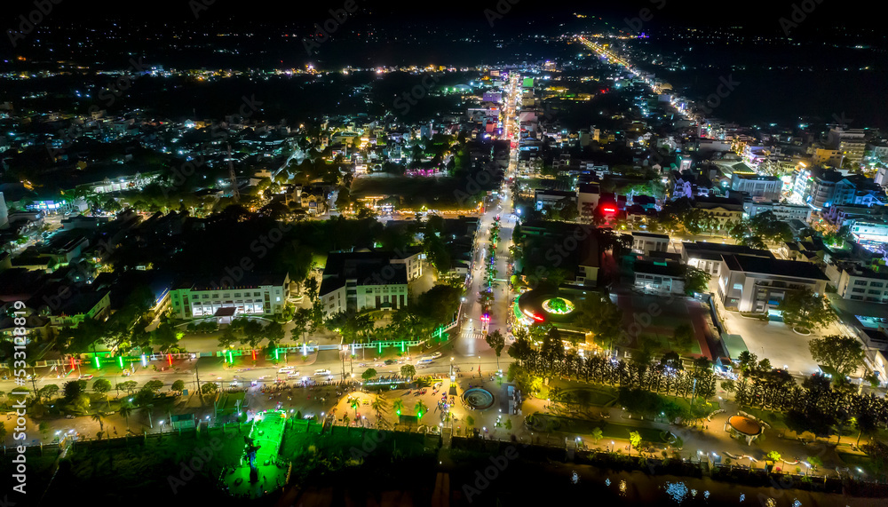 Chau Doc city, An Giang, Vietnam at night, aerial view. This is a large city in Mekong Delta, developing infrastructure, population, and agricultural product trading center in border area of Vietnam Chau Doc city, An Giang, Vietnam at night, aerial view. This is a large city in Mekong Delta, developing infrastructure, population, and agricultural product trading center in border area of Vietnam
