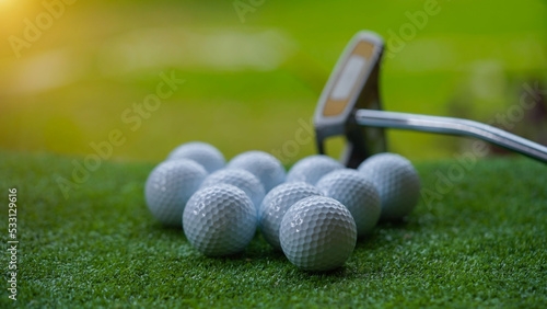 Golf club and ball in grass concept. Golf balls on the golf course with golf clubs.