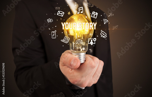 Businessman holding a light bulb, social media concept