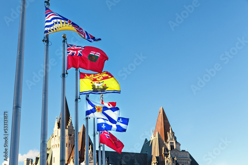 Provincial flags of Canada on Parliament Hill in Ottawa, Ontario. From front to back the flags represent British Columbia, Manitoba, New Brusnwick, Nova Scotia, Quebec and Ontario provinces
