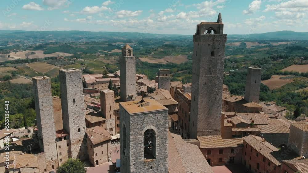 Aerial View Of San Gimignano Town With Medieval Houses And Towers In Italy. Summer Daytime. High quality 4k footage Aerial View Of San Gimignano Town With Medieval Houses And Towers In Italy. Summer Daytime. High quality 4k footage