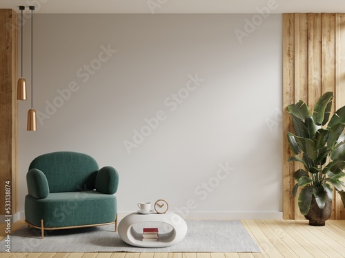 Modern interior of wall space with green armchair on empty white room. photo