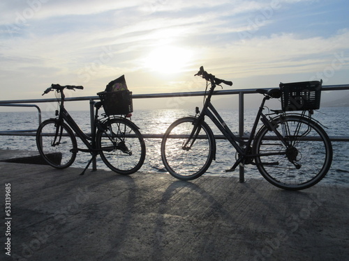 bicycles on the beach at sunset