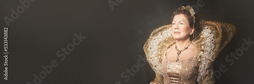 Banner with portrait of the image of Queen Elizabeth I of the 16th century. Historical reconstruction. The image of the queen in smoke on a dark brown background with copy space. High quality photo