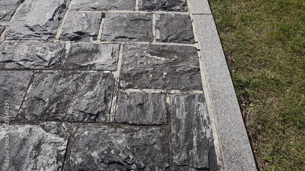 black stone road. stone backgrounds and textures. black stone road. stone backgrounds and textures.