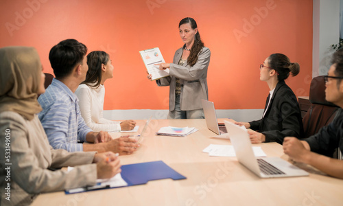 Bild auf Leinwand international male and female business meeting group