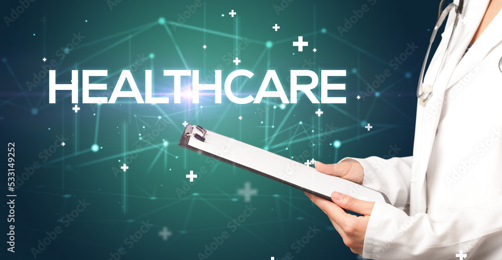 Doctor fills out medical record Doctor fills out medical record