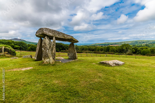 Photo A view across the site of the ancient burial chamber at Pentre Ifan in the Prese