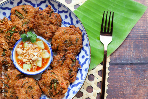 Thai fish cake or Fish cake ball - Thai food called Tod Mun Pla Krai with sweet chili dipping sauce 