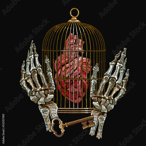 Gothic embroidery. Skeleton hands, anatomical heart, golden key and bird cage . Romantic dark medieaval background. Freedom and captivity concept. Template for clothes, textiles, t-shirt design