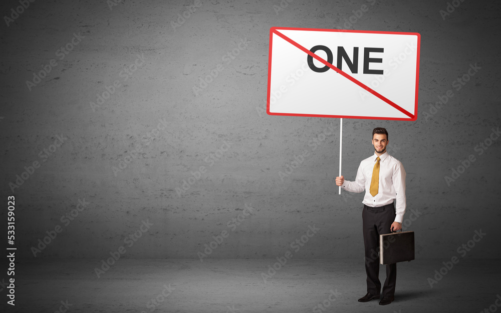 business person holding a traffic sign business person holding a traffic sign