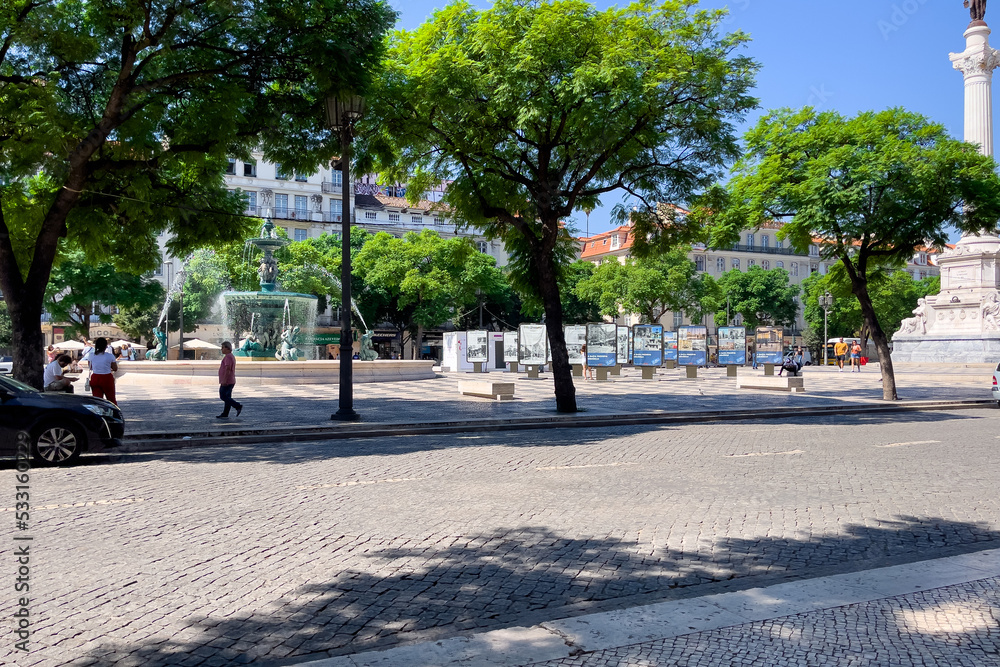  People walking nearby Rossio square in Lisbon 