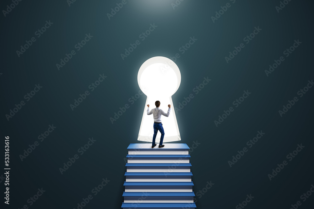 Back view of thoughtful young male standing on stacked books ladder in concrete interior and looking out of keyhole window. Wisdom, success, career, growth, vision and achievement concept. Back view of thoughtful young male standing on stacked books ladder in concrete interior and looking out of keyhole window. Wisdom, success, career, growth, vision and achievement concept.