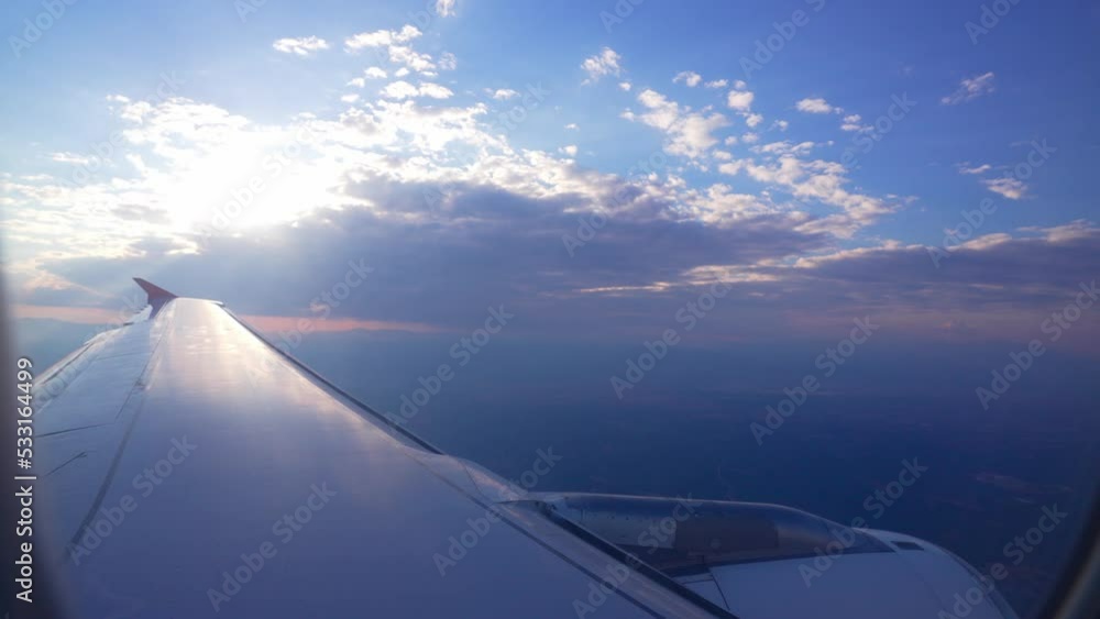Beautiful view from window of plane on wing. Clear blue sky and white clouds from height. Flying in passenger airplane. Traveling in transport. Commercial airliner. Air travel. Tourism weekend. Beautiful view from window of plane on wing. Clear blue sky and white clouds from height. Flying in passenger airplane. Traveling in transport. Commercial airliner. Air travel. Tourism weekend.